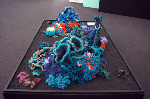 Coral reef sculptures on a plinth.