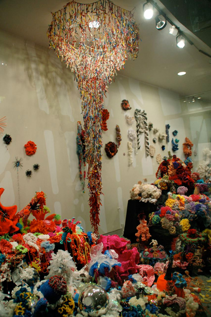 Detail of crochet coral reef sculptures in window vitrine.