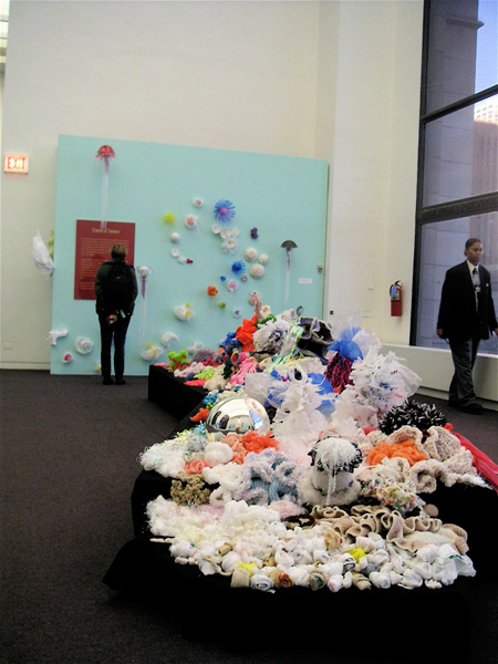 Installation view of crochet coral sculptures in gallery.