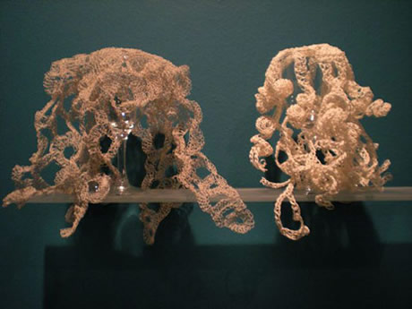 View of hyperbolic crochet coral reef sculpture installed in gallery.
